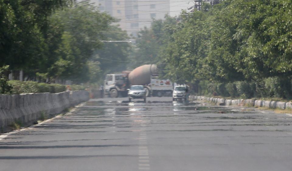 A view of heat haze occurring on the surface of a road near New Delhi, India, 28 April 2022 (EPA)