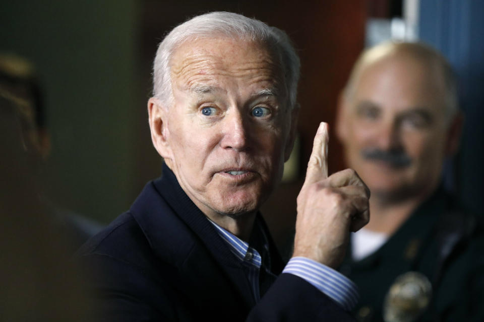 Former vice president and Democratic presidential candidate Joe Biden interacts with a supporter during a campaign stop at the Community Oven restaurant in Hampton, N.H., Monday, May 13, 2019. (AP Photo/Michael Dwyer)