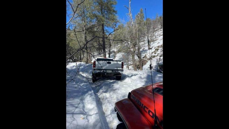 A missing couple and their dog were found safe after their truck got stuck in the snow while they were driving home, Arizona authorities said.