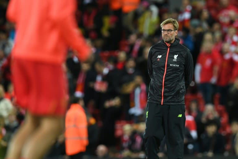 Liverpool manager Jurgen Klopp watches his players warm up before their Premier League match against Manchester United at Anfield on October 17, 2016