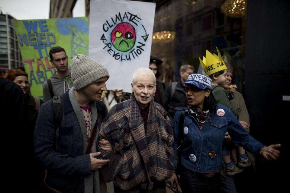 FILE - British Fashion designer Vivienne Westwood, center, takes part in an environmental protest against the practice of fracking being used in Britain, to coincide with a Shale Gas Forum being held in London on March 19, 2014. Westwood, an influential fashion maverick who played a key role in the punk movement, died Thursday, Dec. 29, 2022, at 81. (AP Photo/Matt Dunham, File)