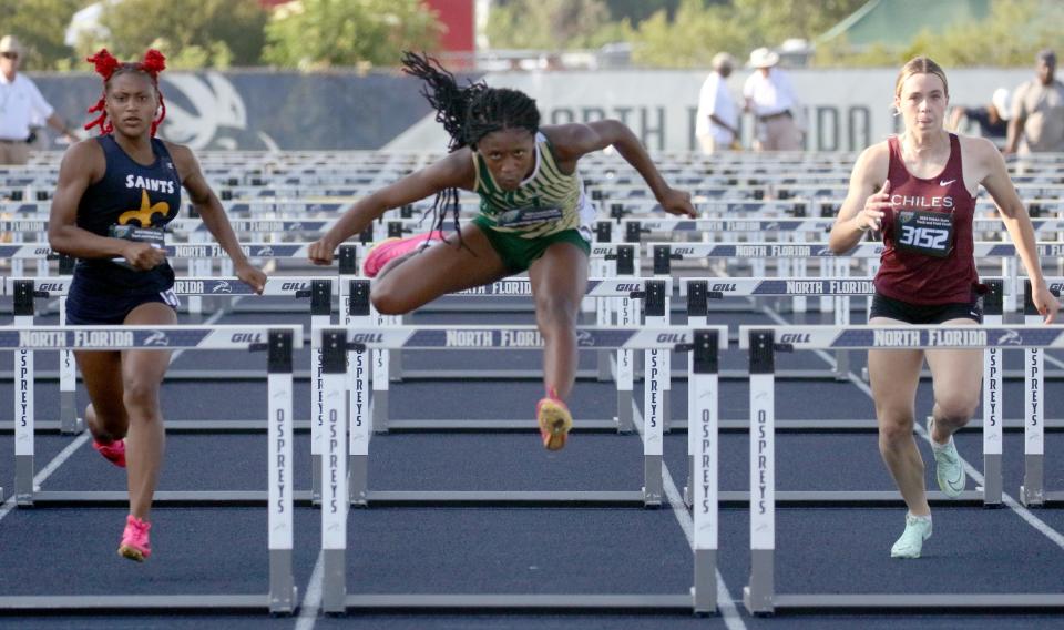 George Jenkins junior Chelsi Williams jumps over the last hurdle en route to winning the 100-meter hurdles on Saturday at the 2023 FHSAA Class 4A State Track and Field Meet at Hammond Stadium in Jacksonville.