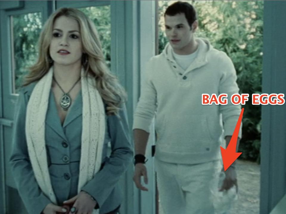 Rosalie and Emmett, who's carrying a bag of eggs, walking into the cafeteria in Twilight