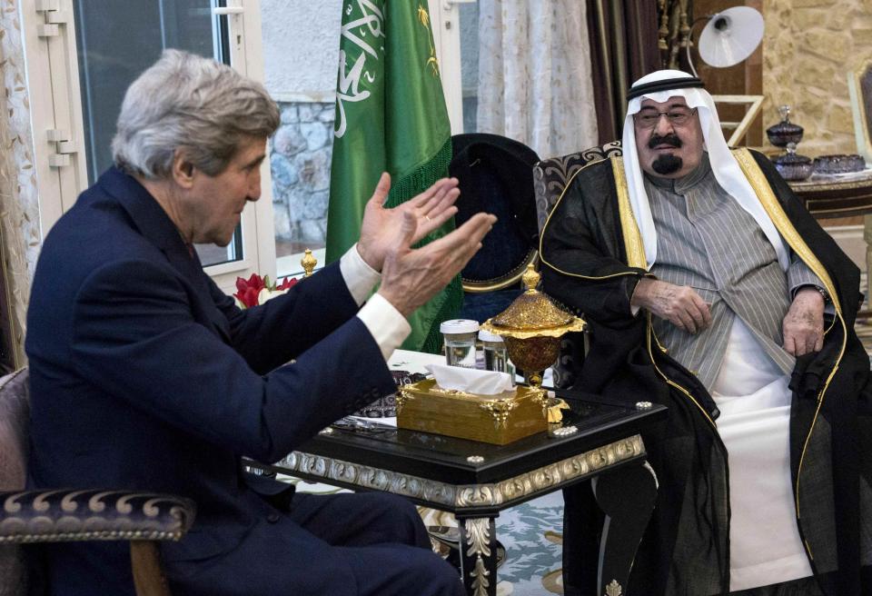 U.S. Secretary of State John Kerry (L) and Saudi Arabia's King Abdullah bin Abdulaziz al-Saud talk before a meeting at the King's desert encampment in Rawdat al-Khuraim January 5, 2014. REUTERS/Brendan Smialowski/Pool (SAUDI ARABIA - Tags: POLITICS ROYALS)