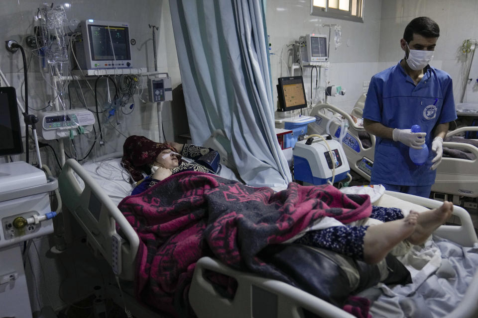 FILE - A woman who was injured in the devastating earthquake, is treated at the hospital in Bab al-Hawah, Syria, on the border crossing with Turkey, Sunday, Feb. 12, 2023. The massive earthquake that hit last week is the latest in a litany of hardships for Syrian women, many of whom have been left dependent on aid and alone responsible for their families' well-being. (AP Photo/Hussein Malla, File)