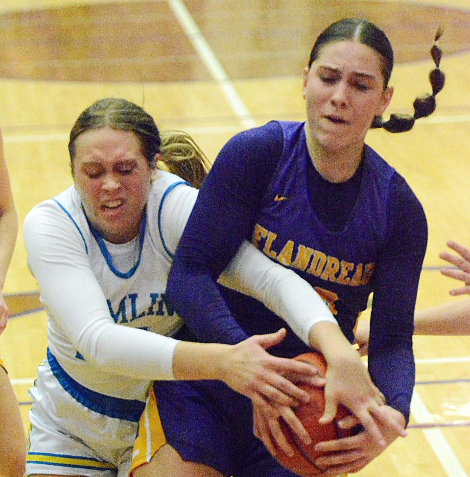 Hamlin's Ally Abraham (left) and Flandreau's Lizzie Pavlis battle for the ball during their first-round game in the state Class A high school girls basketball tournament on Thursday, March 9, 2023 in the Watertown Civic Arena.