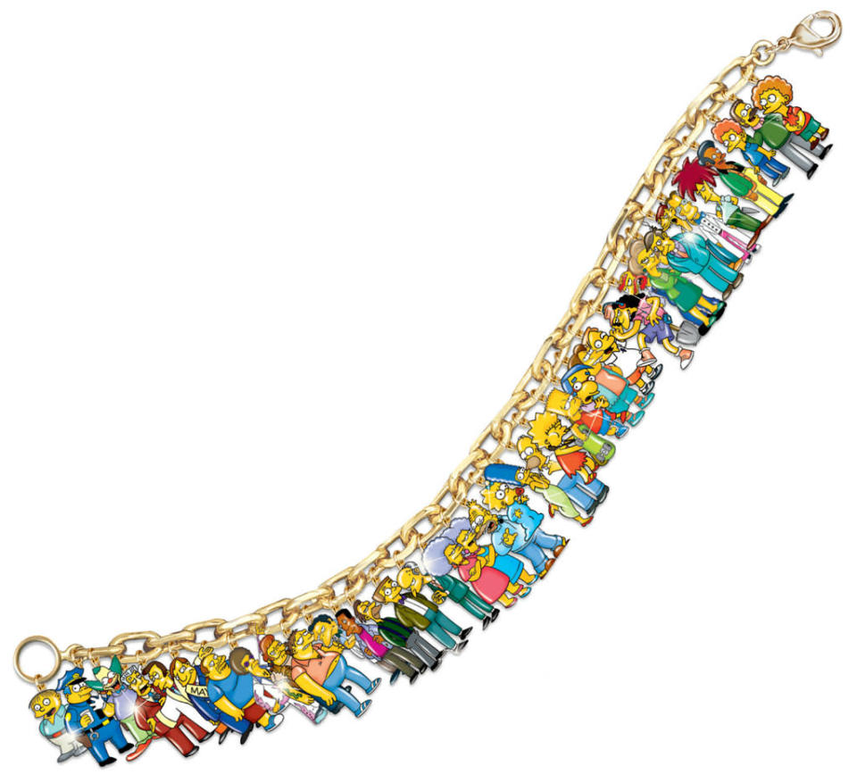 <b>FASHION<br><br>"The Simpsons" Ultimate Charm Bracelet</b><br>Thirty-seven Springfieldians adorn this bright bracelet, including Homer, Bart, and the rest of the Simpsons clan, as well as town faves like Barney, Milhouse, Otto, Krusty, Mr. Burns, the Flanders fam, Nelson, and Comic Book Guy. <br><br><a href="http://www.bradfordexchange.com/products/103857001_the-simpsons-bracelet.html" rel="nofollow noopener" target="_blank" data-ylk="slk:BradfordExchange.com;elm:context_link;itc:0;sec:content-canvas" class="link ">BradfordExchange.com</a>, $199.99