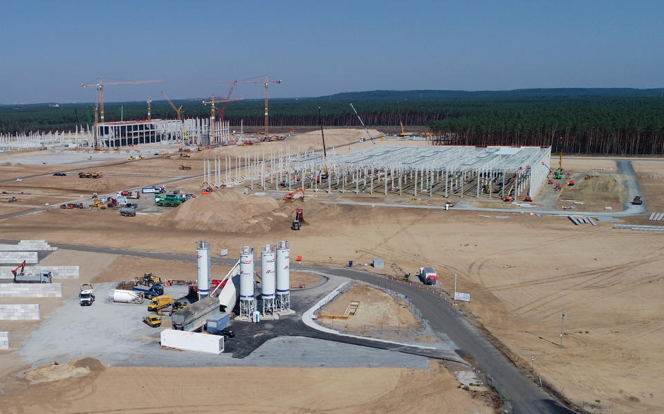 11 August 2020, Brandenburg, Gr&#xfc;nheide: View over the construction site with the emerging shell for the future Tesla Giga-Factory (aerial view with a drone). In Gr&#xfc;nheide near Berlin, a maximum of 500,000 vehicles per year are to roll off the assembly line from July 2021 - and according to the car manufacturer&#39;s plans, the maximum should be reached as quickly as possible. The US electric car manufacturer expects up to 10,500 employees in shift operation for its planned first factory in Europe for the time being. Photo: Patrick Pleul/dpa-Zentralbild/dpa (Photo by Patrick Pleul/picture alliance via Getty Images)