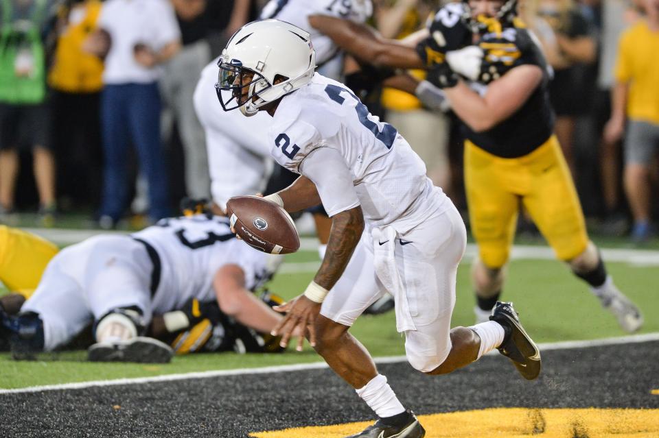 Nittany Lions quarterback Ta'Quan Roberson scrambles in the end zone against the Hawkeyes.