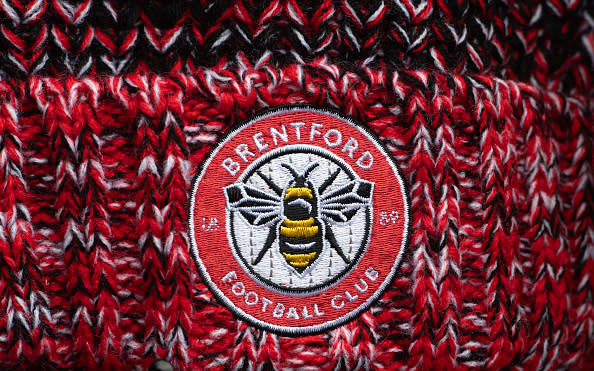 BRENTFORD, ENGLAND - DECEMBER 02: A detailed view of a Brentford crest is seen on a hat prior to the Premier League match between Brentford FC and Luton Town at Gtech Community Stadium on December 02, 2023 in Brentford, England. (Photo by Visionhaus/Getty Images)