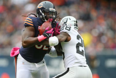 FILE PHOTO: Oct 4, 2015; Chicago, IL, USA; Chicago Bears outside linebacker Pernell McPhee (92) intercepts a pass intended for Oakland Raiders running back Latavius Murray (28) during the second quarter at Soldier Field. Mandatory Credit: Jerry Lai-USA TODAY Sports