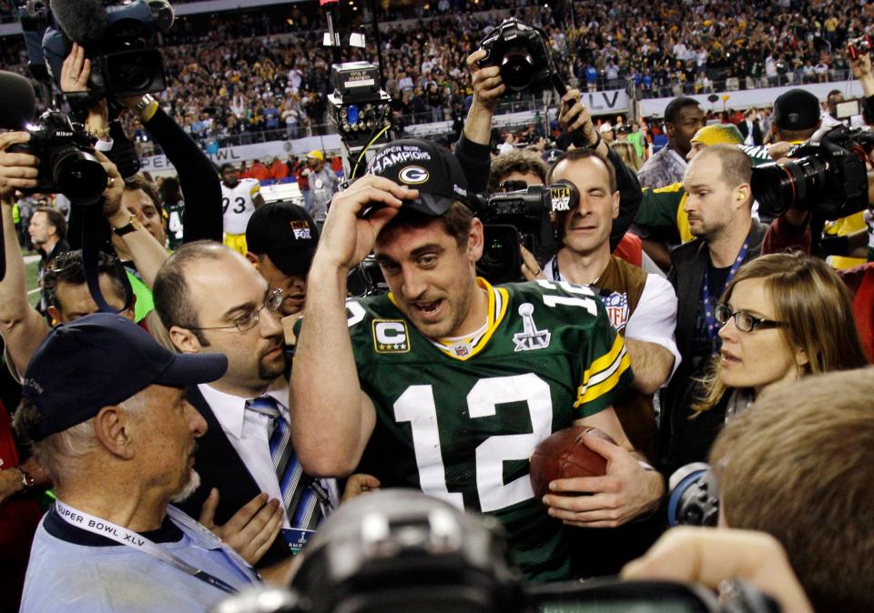 FILE - In this Feb. 6, 2011, file photo, Green Bay Packers quarterback Aaron Rodgers (12) celebrates the Packers' 31-25 win against the Pittsburgh Steelers after the NFL Super Bowl XLV football game in Arlington, Texas.