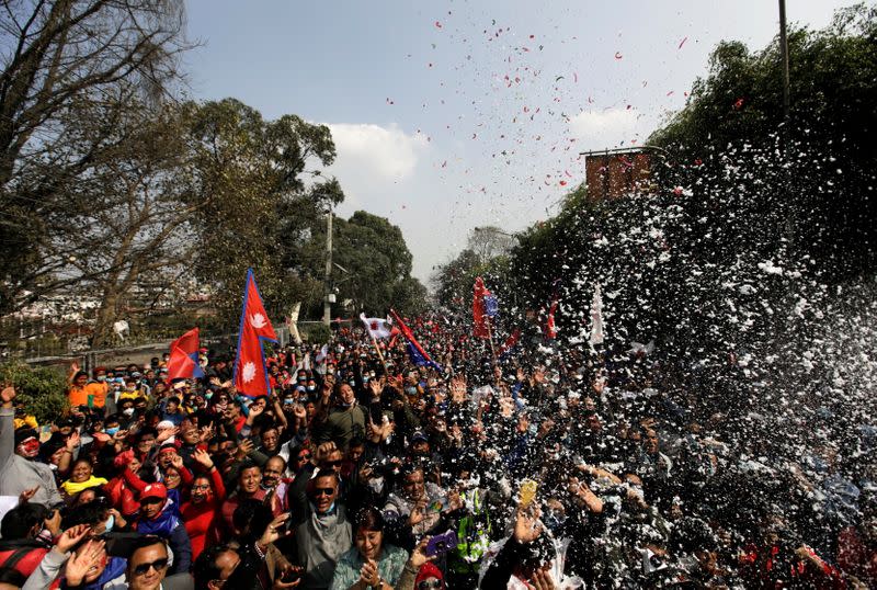 Supporters of a faction of the ruling Nepal Communist Party take part in a rally celebrating the reinstatement of the parliament by Nepal’s top court in Kathmandu