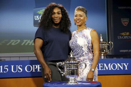 Serena Williams (L) of the U.S. poses for photographers with USTA President Katrina Adams at the official draw ceremony for the 2015 US Open tennis tournament at the USTA Billie Jean King National Tennis Center in New York, August 27, 2015. Play begins at the US Open on August 31. REUTERS/Mike Segar