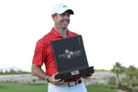 Rory McIlroy, of Northern Ireland, displays the trophy after winning the CJ Cup golf tournament, Sunday, Oct. 17, 2021, in Las Vegas. (AP Photo/David Becker)