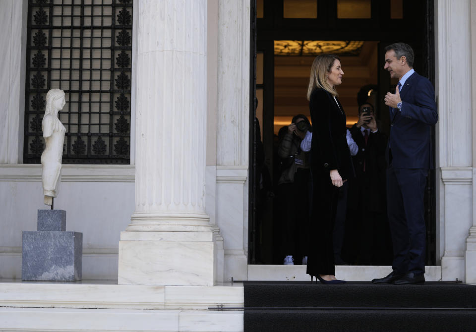 Greece's Prime Minister Kyriakos Mitsotakis, right, speaks with European Parliament President Roberta Metsola after their meeting at Maximos Mansion in Athens, Greece, Tuesday, Feb. 20, 2024. Metsola is in Athens on Tuesday, as part of her campaign to raise awareness and encourage people to vote in the European Parliament elections in June. (AP Photo/Thanassis Stavrakis)