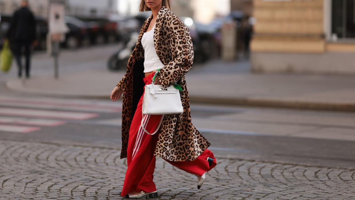 a woman walking down a street