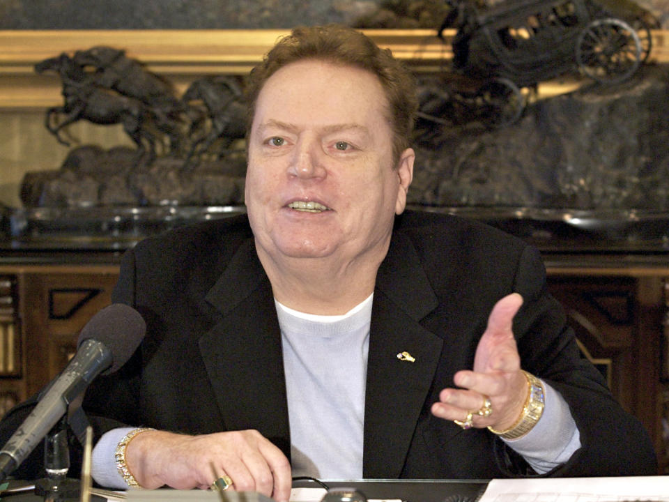 FILE - Larry Flynt Publications Inc. (LFP) Publisher Larry Flynt comments on the resignation of former New York Governor Eliot Spitzer, during an interview with The Associated Press in his office in Beverly Hills, Calif. on March 14, 2008. Flynt, who turned "Hustler" magazine into an adult entertainment empire while championing First Amendment rights, has died at age 78. His nephew, Jimmy Flynt Jr., told The Associated Press that Flynt died Wednesday, Feb. 10, 2021, of heart failure at his Hollywood Hills home in Los Angeles. (AP Photo/Damian Dovarganes, File)