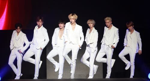 Monsta X looking sleek in their matching white suits.