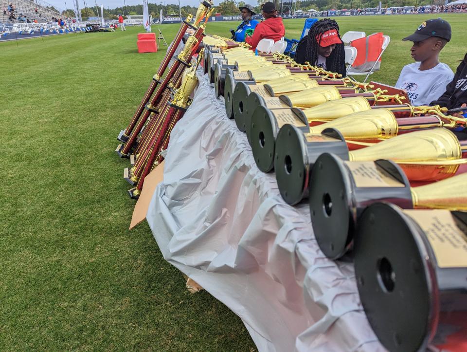 Trophies line up in the Hodges Stadium infield at the Bob Hayes Invitational Track Meet on March 18, 2023. [Clayton Freeman/Florida Times-Union]