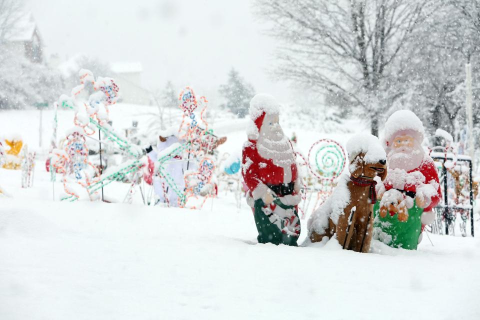Christmas decorations in the snow on Hill and Dale Road in Carmel during a steady snowfall Nov. 26, 2014. 