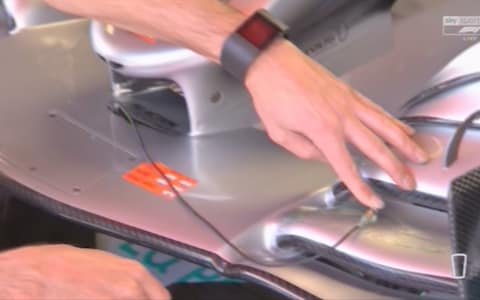 Mercedes use ultrasound to check a front wing - Credit: SKY SPORTS F1