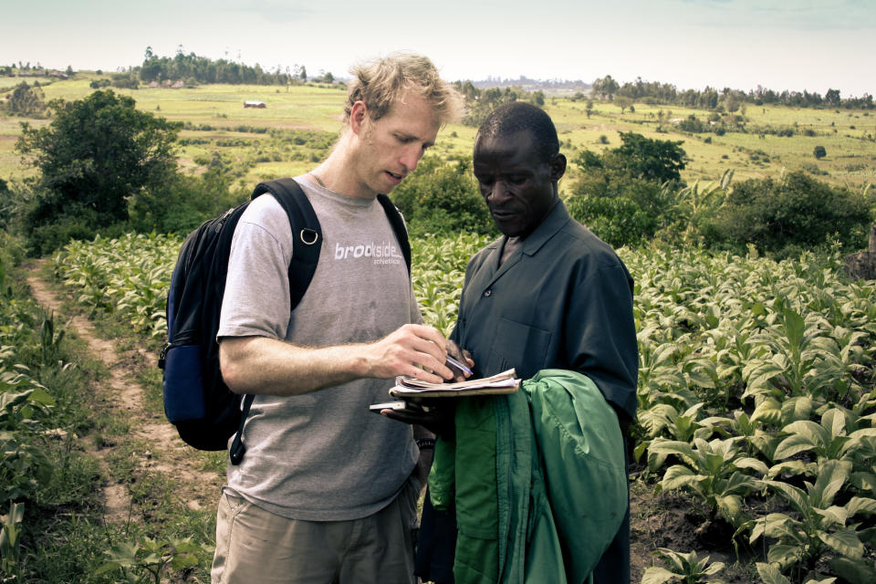 Jake Harriman talks to agriculture field manager James Magaigwa Chacha in Kenya. Nuru's development projects are locally owned and operated. (Photo: Courtesy of Nuru International)