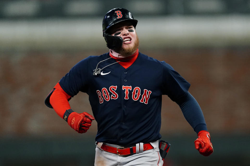 Boston Red Sox's Alex Verdugo (99) reacts as he runs the bases after hitting a three-run home run in the eighth inning of the team's baseball game against the Atlanta Braves on Tuesday, June 15, 2021, in Atlanta. (AP Photo/John Bazemore)