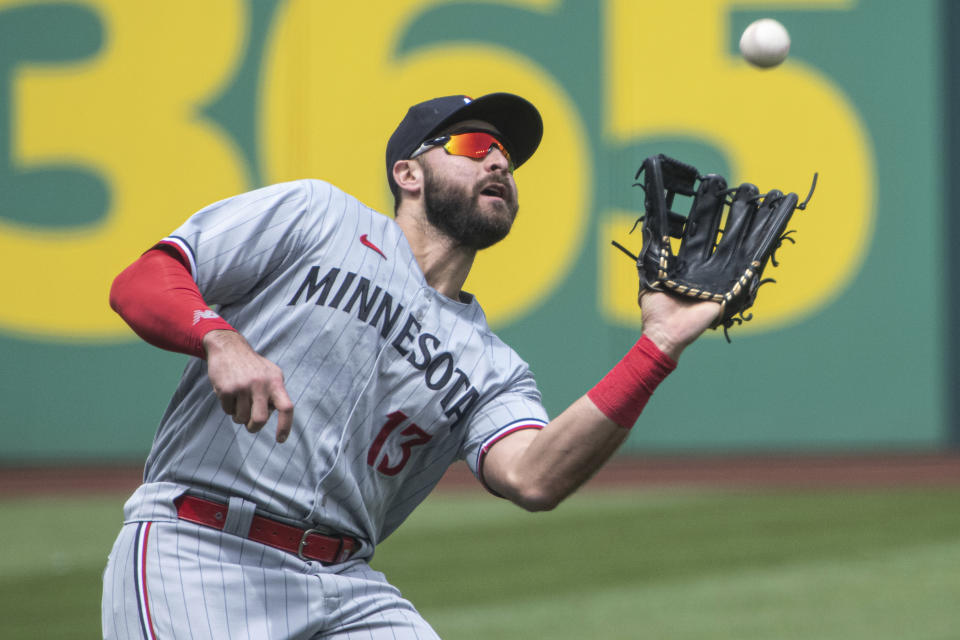 Minnesota Twins' Joey Gallo catches a pop fly by Cleveland Guardians' Andres Gimenez during the first inning of a baseball game in Cleveland, Sunday, May 7, 2023. (AP Photo/Phil Long)