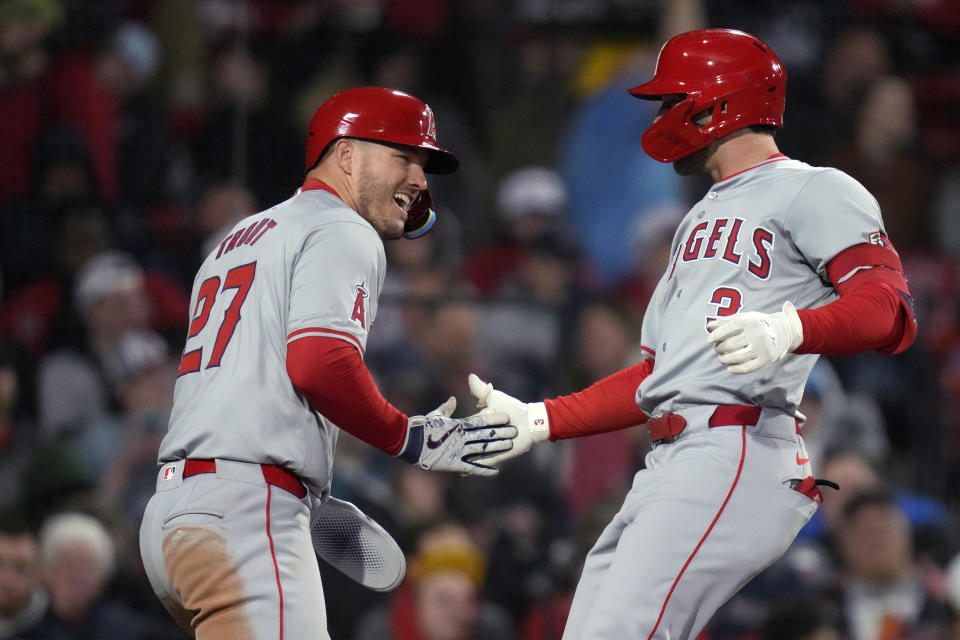 Los Angeles Angels' Taylor Ward, right, is congratulated by Mike Trout (27) after his two-run home run against the Boston Red Sox during the sixth inning of a baseball game Friday, April 12, 2024, in Boston. (AP Photo/Charles Krupa)