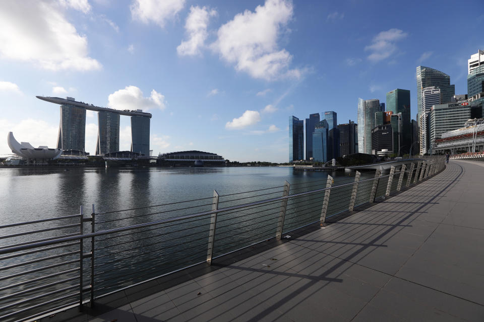 SINGAPORE - MARCH 24:  A general view of an empty attraction at a normally busy Jubilee Bridge, Marina Bay Sands, the ArtSicience Museum and the Singapore skyline on March 24, 2020 in Singapore. Singapore will not allow short term visitors to enter or transit through the country from March 24 to contain the spread of the imported COVID-19  infection.  (Photo by Suhaimi Abdullah/Getty Images)