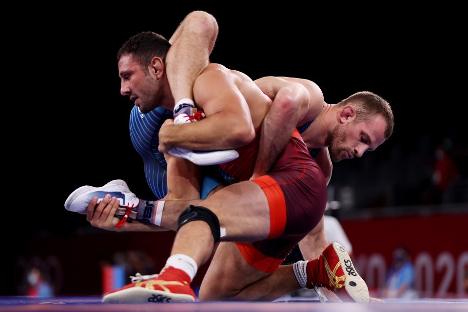 Brighton's Myles Amine (foreground), competing for San Marino, wrestles David Taylor of the United States in the men's freestyle 86-kilogram quarterfinals at the Olympic Games on Wednesday, Aug. 4, 2021 in Chiba, Japan.