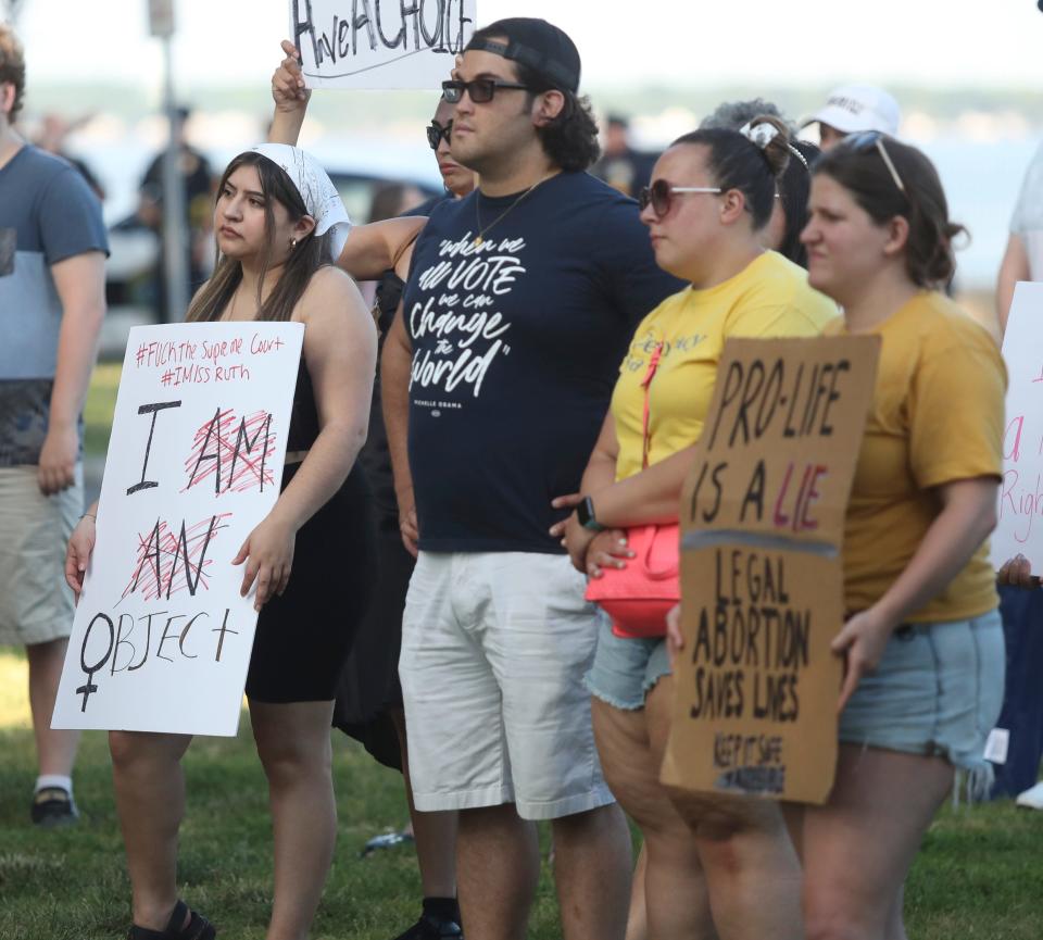 Ayline Mejia of New Castle (left) stands with other abortion-rights protesters at a demonstration in Battery Park in New Castle in reaction to the Supreme Court striking down Federal protection for abortion Friday, June 24, 2022.