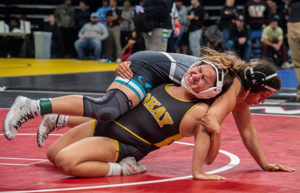 Tokay's Maliah Gomez, bottom, grapples with Sheldon's Chrystina Ballejos in the 170-lb weight class of the Sac-Joaquin Section Girls Masters Wrestling Tournament at the Adventist Health arena in downtown Stockton on Feb. 16, 2024.