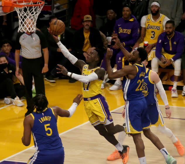 Los Angeles, CA - May 08: Lakers guard Dennis Schroder slices to the basket for a layup against the Warriors in the second half of Game 4 of the Western Conference semifinals at Crypto.com Arena in Los Angeles on Monday, May 8,, 2023. The Lakers won, 104-101. Los Angeles on Monday, May 8, 2023 in Los Angeles, CA. (Luis Sinco / Los Angeles Times)