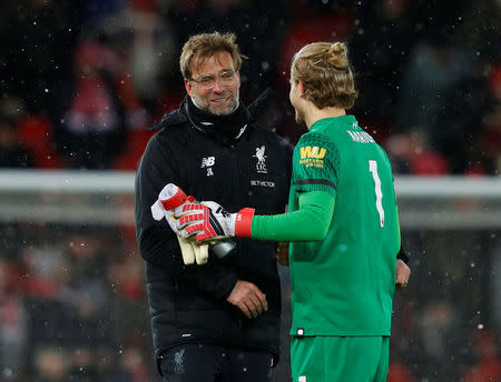 Soccer Football - Premier League - Liverpool vs Watford - Anfield, Liverpool, Britain - March 17, 2018 Liverpool manager Juergen Klopp and Loris Karius celebrate after the match REUTERS/Phil Noble