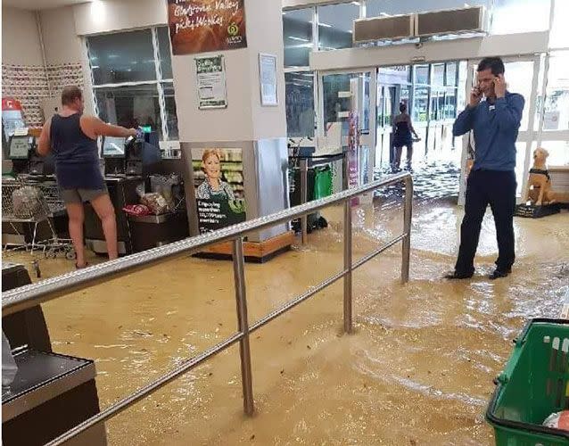 'Cleanup in aisle four': A Woolworths supermarket in Gladstone has been swamped with water. Picture: Rochelle Alley