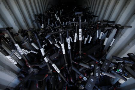 Some of the thousands of BIRD scooters are shown at Scoot Scoop after the company impounded the devices when contracted by private property owners who no longer want them being left on their property in San Diego, California