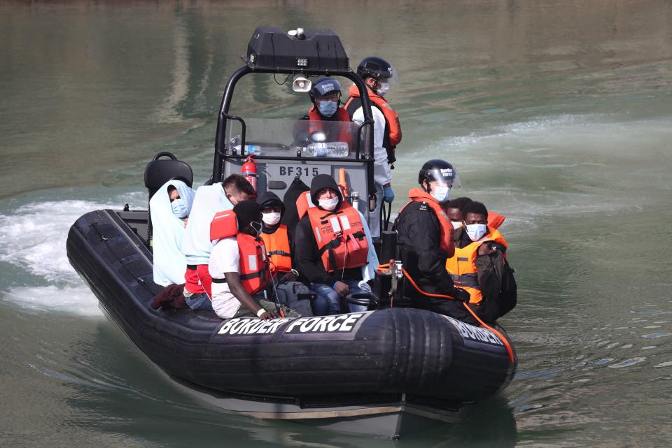 <p>A Border Force patrol with migrants from a small boat in the Channel</p> (PA)