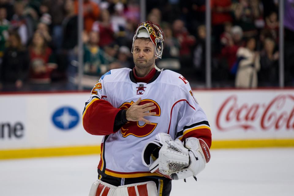 Apr 9, 2016; Saint Paul, MN, USA; Calgary Flames goalie Niklas Backstrom (32) salutes the fans after the game after being named first star after the game against the Minnesota Wild at Xcel Energy Center. Mandatory Credit: Brad Rempel-USA TODAY Sports