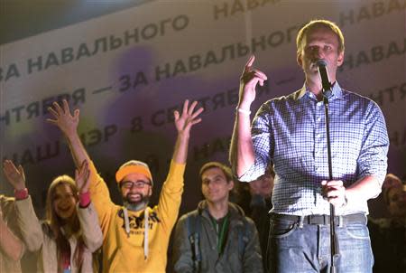 Russian opposition leader Alexei Navalny (R) addresses supporters during a rally in Moscow, September 9, 2013. REUTERS/Tatyana Makeyeva