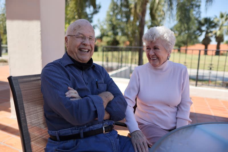 World War II veteran William Lloyd Roberts, 94, and his wife, Erma Lee Hanna Roberts, 91, sit on a patio, having received both doses of the coronavirus disease (COVID-19) vaccine at Mission Commons assisted living community in Redlands