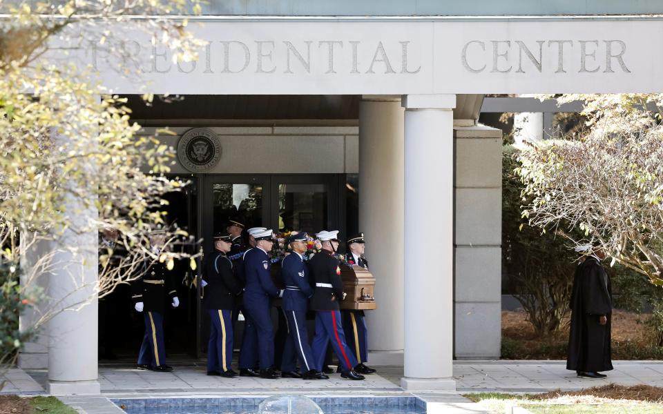 An Armed Forces body bearer team carries the casket of former first lady Rosalynn Carter from the Jimmy Carter Presidential Library and Museum,Tuesday, Nov. 28, 2023, in Atlanta. (Erik S. Lesser/Pool via AP)