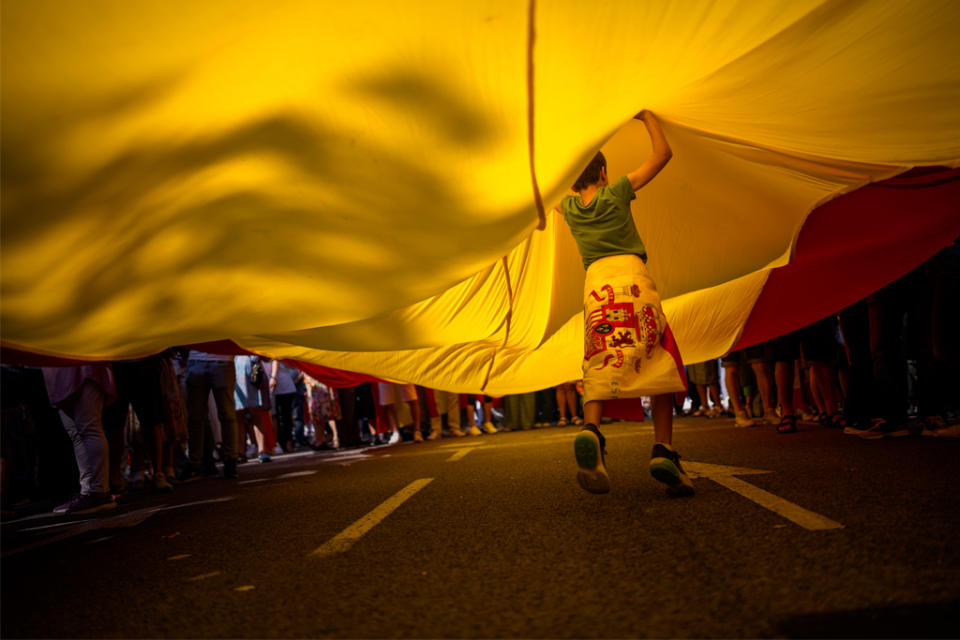 A boy playing in the street.