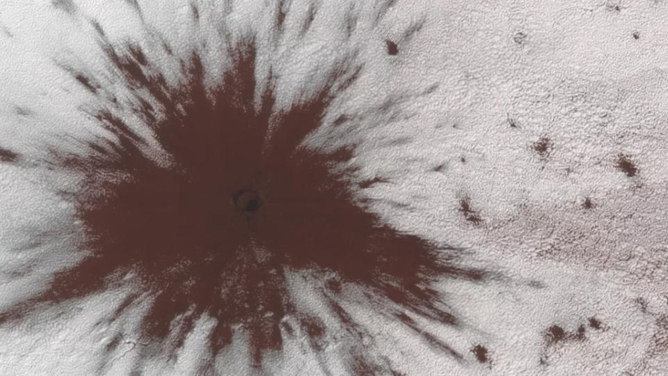 A large object such as a meteoroid hit near Mars' southern ice cap, puncturing the ice and creating a splat.