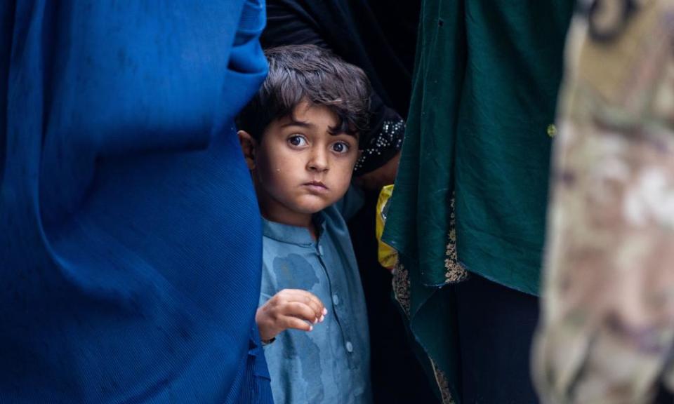 Refugees from Afghanistan waiting to board buses outside Dulles airport.