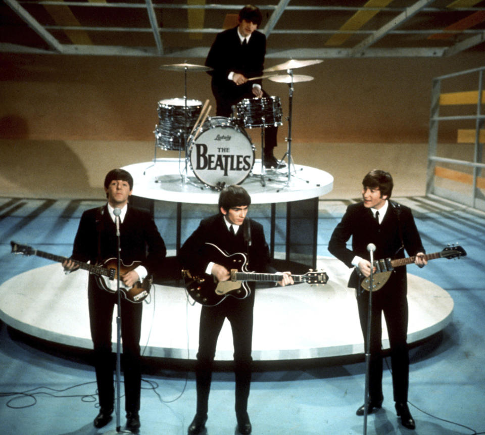 FILE -The Beatles, foreground from left, Paul McCartney, George Harrison, John Lennon and Ringo Starr on drums perform on the CBS "Ed Sullivan Show" in New York on Feb. 9, 1964. The Television Academy, which presents the Emmy Awards, announced on Friday, Jan. 12, 2024, what it calls the top 75 moments in television history ahead of the ceremony's 75th edition, being held on Monday, Jan. 15. (AP Photo/File)