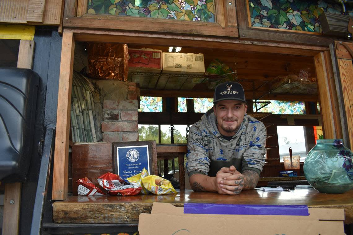 Zack Perez, who works at the Wildfire Pizza truck, helps serve Moore County residents, many of whom have been without power since Saturday.