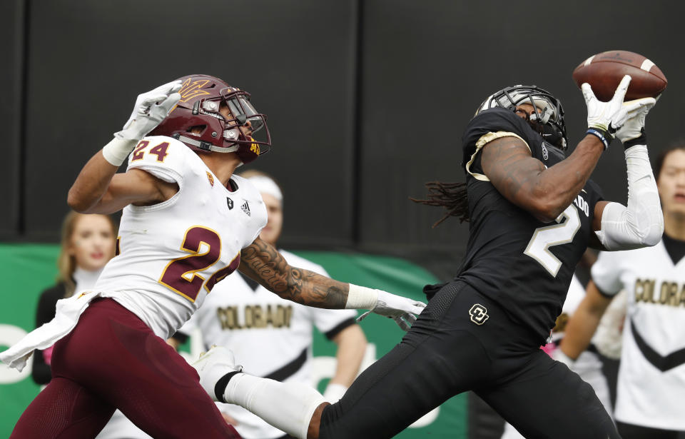 Colorado wide receiver Laviska Shenault Jr., right, pulls in a pass for a touchdown as Arizona State defensive back Chase Lucas covers in the second half of an NCAA college football game Saturday, Oct. 6, 2018, in Boulder, Colo. Colorado won 28-21. (AP Photo/David Zalubowski)