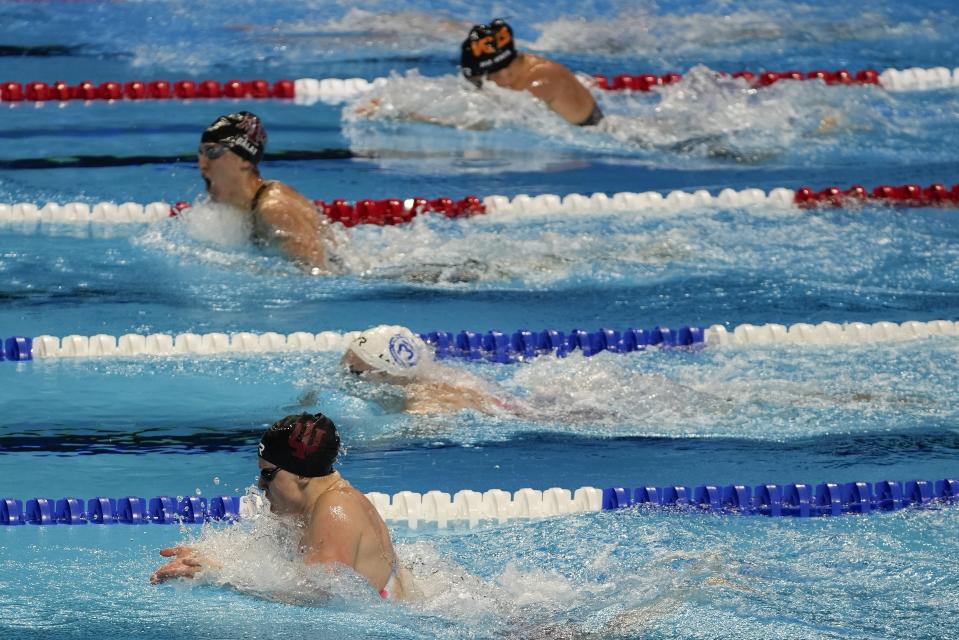 Lilly King participates in the women's 100 breaststroke during wave 2 of the U.S. Olympic Swim Trials on Tuesday, June 15, 2021, in Omaha, Neb. (AP Photo/Jeff Roberson)